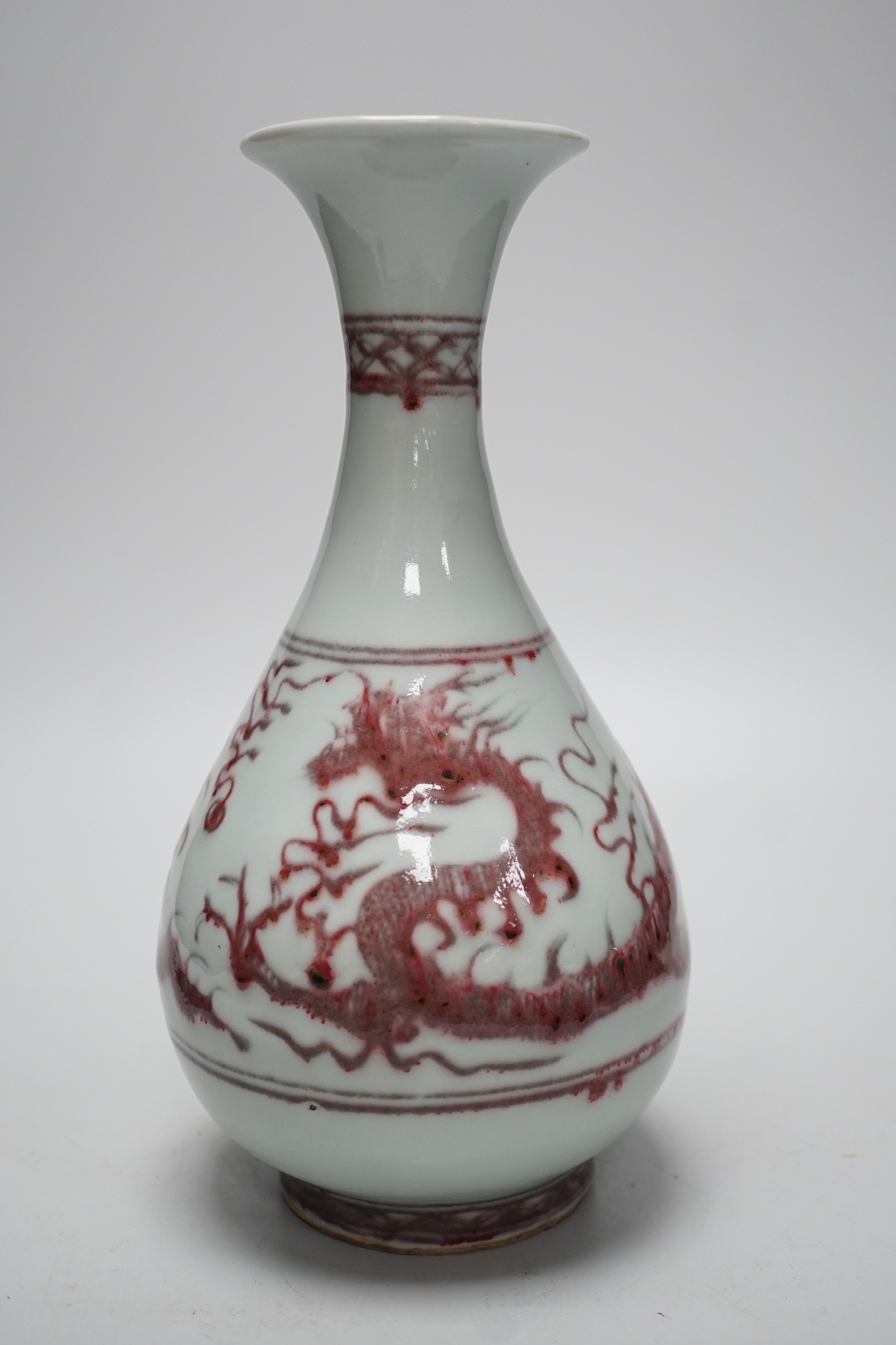 A Chinese underglaze copper red ‘dragon’ vase, 24.5cm